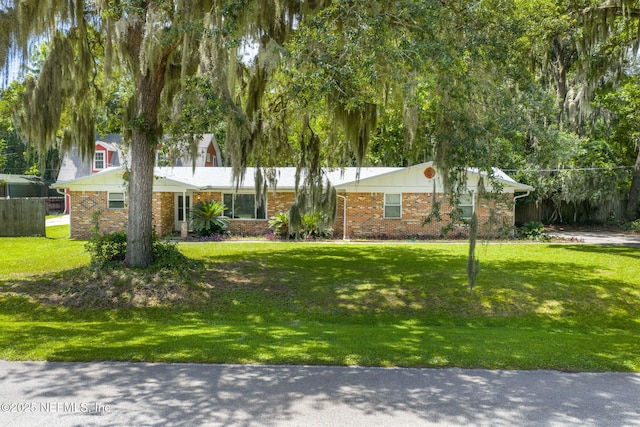 136 Hollywood Forest Dr, Fleming Island, FL 32003 - view of front of property featuring a front lawn and brick siding