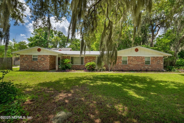 136 Hollywood Forest Dr, Fleming Island, FL 32003 - ranch-style home featuring board and batten siding and brick siding