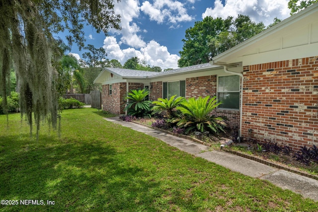 136 Hollywood Forest Dr, Fleming Island, FL 32003 - view of home's exterior featuring brick siding