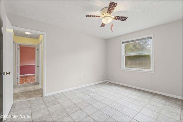 136 Hollywood Forest Dr, Fleming Island, FL 32003 - empty room with a textured ceiling, light tile patterned flooring, and a ceiling fan