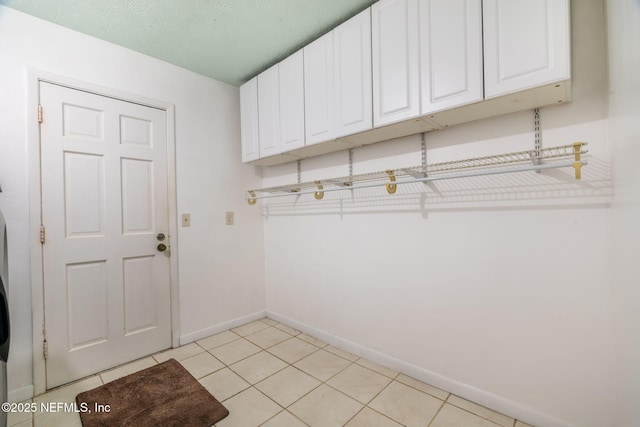 136 Hollywood Forest Dr, Fleming Island, FL 32003 - laundry room with baseboards and cabinet space