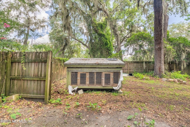 136 Hollywood Forest Dr, Fleming Island, FL 32003 - fenced backyard with exterior structure and an outbuilding