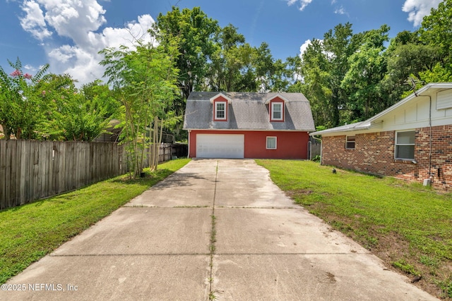 136 Hollywood Forest Dr, Fleming Island, FL 32003 - dutch colonial featuring an outdoor structure, a garage, brick siding, a shingled roof, and concrete driveway