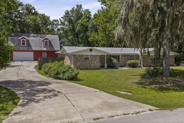 136 Hollywood Forest Dr, Fleming Island, FL 32003 - view of front of house with a garage, brick siding, and concrete driveway
