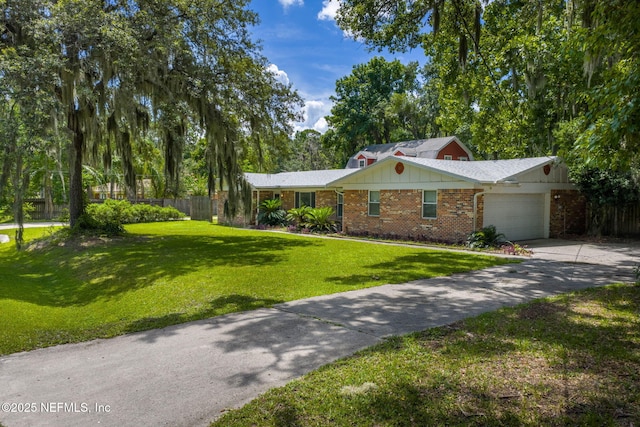 136 Hollywood Forest Dr, Fleming Island, FL 32003 - single story home with a garage, concrete driveway, and brick siding