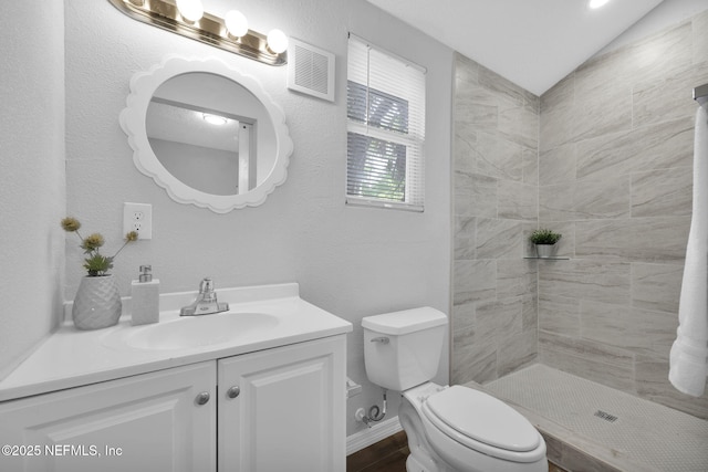405 W 19th St, Jacksonville, FL 32206 - bathroom with vanity, tiled shower, and lofted ceiling