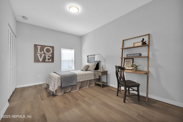 405 W 19th St, Jacksonville, FL 32206 - bedroom featuring wood finished floors and a textured ceiling