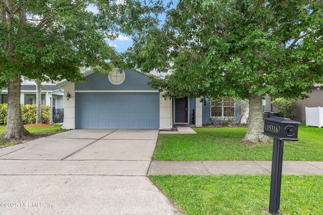 15316 Perdido Dr, Orlando, FL 32828 - view of property hidden behind natural elements featuring stucco siding, an attached garage, a front yard, and driveway