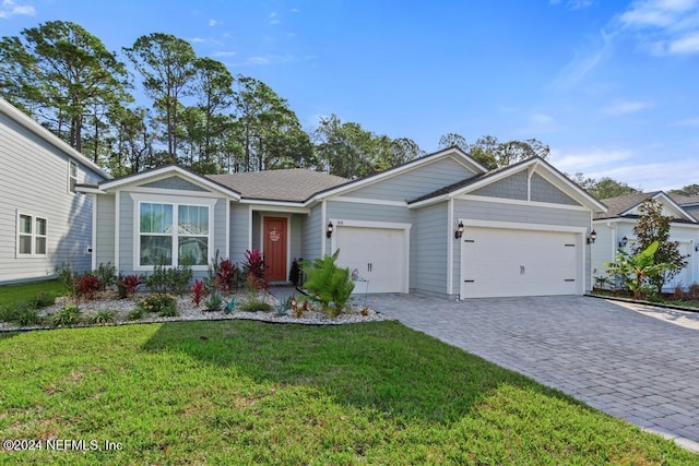 188 Sundown Covey Trl, Saint Augustine, FL 32095 - single story home featuring a garage, a front yard, and decorative driveway