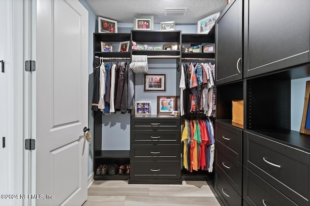 188 Sundown Covey Trl, Saint Augustine, FL 32095 - walk in closet with light wood finished floors