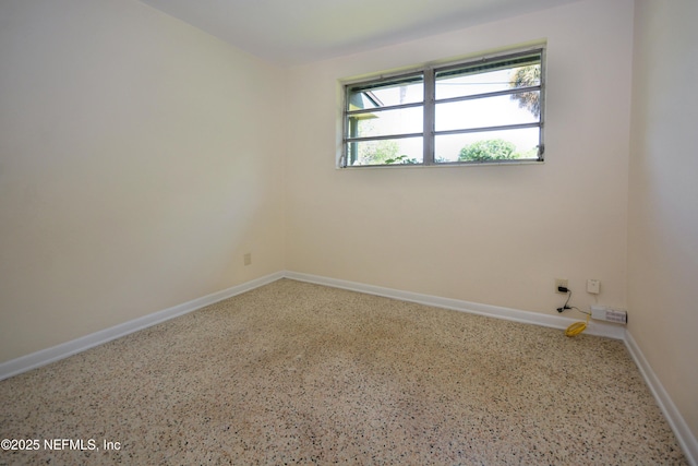 4316 Ferrarra St, Jacksonville, FL 32217 - empty room featuring speckle patterned floor