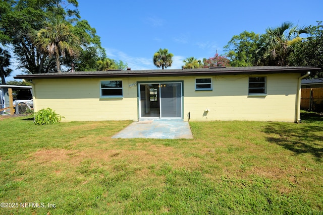 4316 Ferrarra St, Jacksonville, FL 32217 - back of house featuring concrete block siding and a patio