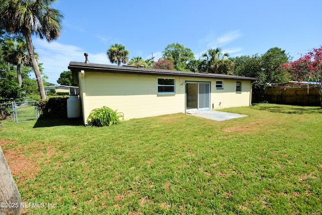4316 Ferrarra St, Jacksonville, FL 32217 - rear view of property featuring concrete block siding and a fenced backyard