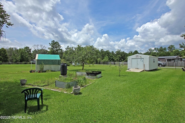54002 Evergreen Trl, Callahan, FL 32011 - view of yard with a storage shed and a vegetable garden