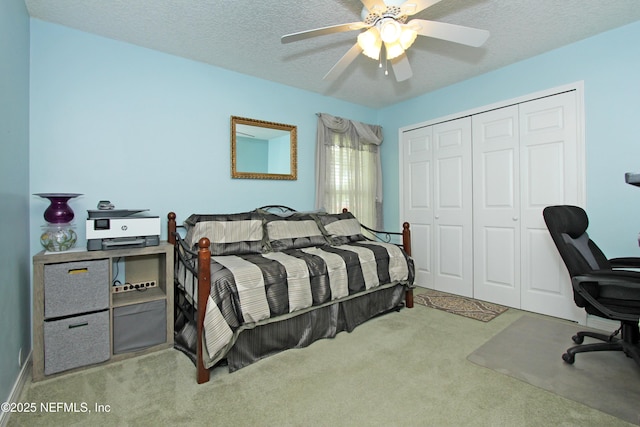 54002 Evergreen Trl, Callahan, FL 32011 - carpeted bedroom featuring a closet, a desk, a ceiling fan, and a textured ceiling