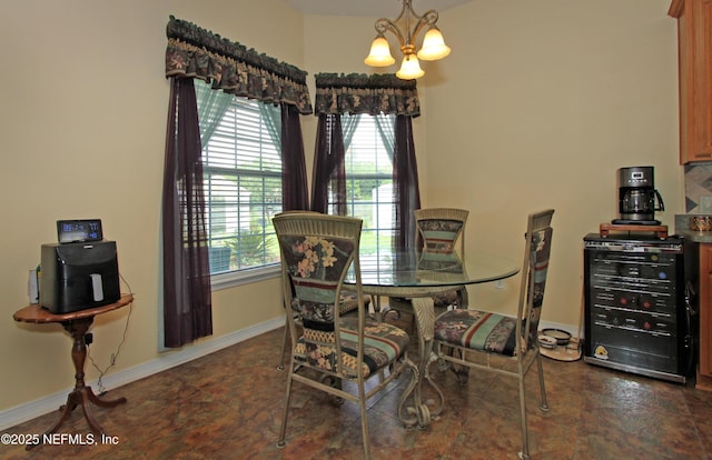 54002 Evergreen Trl, Callahan, FL 32011 - dining area with wine cooler, a chandelier, and plenty of natural light