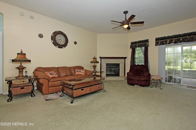 54002 Evergreen Trl, Callahan, FL 32011 - carpeted living room with a ceiling fan, a fireplace, and a textured ceiling