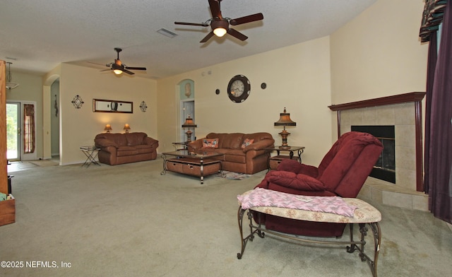54002 Evergreen Trl, Callahan, FL 32011 - carpeted living room featuring arched walkways, ceiling fan, and a tile fireplace