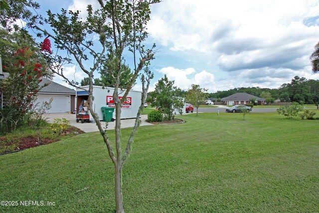54002 Evergreen Trl, Callahan, FL 32011 - view of green lawn with driveway