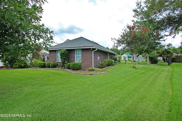 54002 Evergreen Trl, Callahan, FL 32011 - view of side of property with brick siding and a shingled roof
