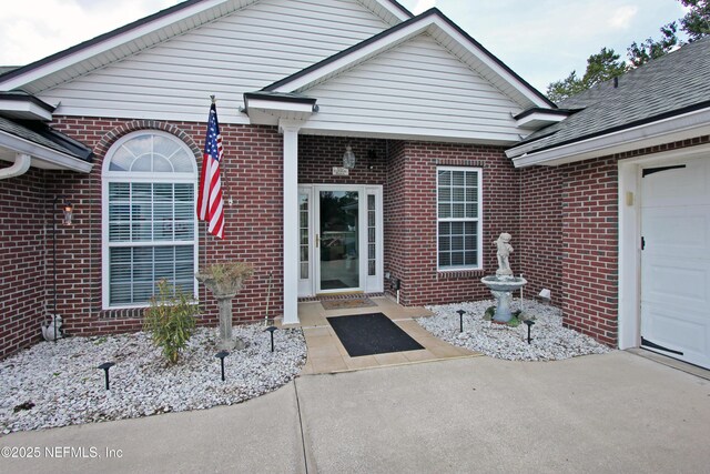 54002 Evergreen Trl, Callahan, FL 32011 - view of exterior entry with brick siding and a garage