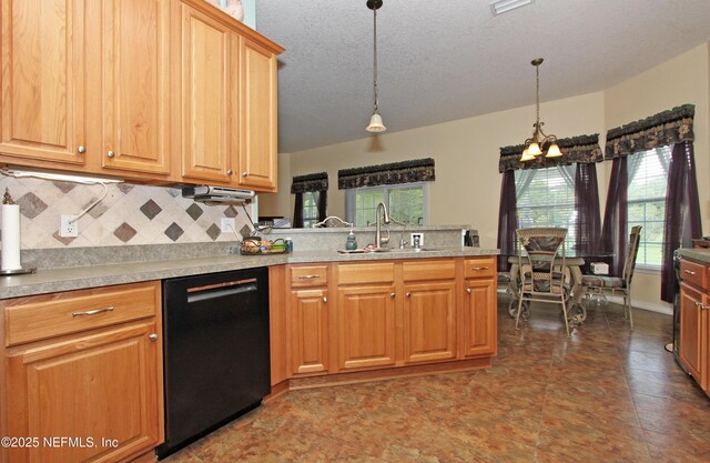 54002 Evergreen Trl, Callahan, FL 32011 - kitchen featuring black dishwasher, a peninsula, tasteful backsplash, a textured ceiling, and light countertops