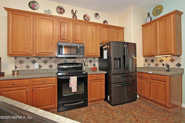 54002 Evergreen Trl, Callahan, FL 32011 - kitchen featuring stainless steel microwave, refrigerator with ice dispenser, electric range, decorative backsplash, and brown cabinetry