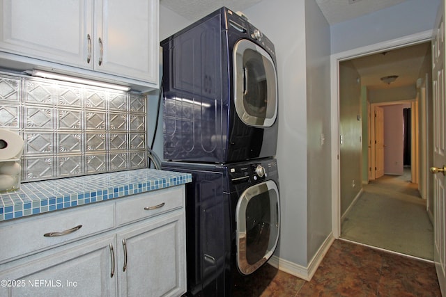 54002 Evergreen Trl, Callahan, FL 32011 - washroom with stacked washer and clothes dryer and cabinet space