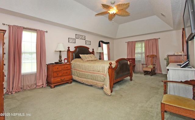 54002 Evergreen Trl, Callahan, FL 32011 - carpeted bedroom with multiple windows, ceiling fan, and vaulted ceiling