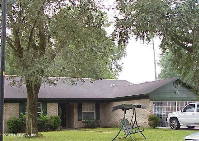 4725 Cinnamon Fern Dr, Jacksonville, FL 32210 - ranch-style home with brick siding and a front yard