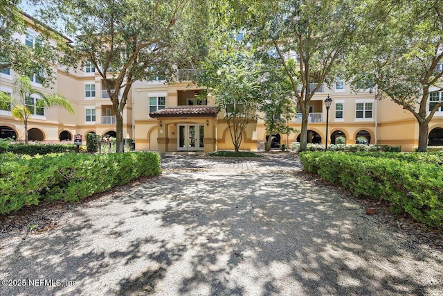 4300 S Beach Pkwy Unit 1206, Jacksonville Beach, FL 32250 - view of front of home featuring french doors and stucco siding