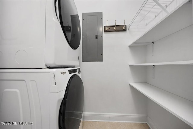 4300 S Beach Pkwy Unit 1206, Jacksonville Beach, FL 32250 - washroom featuring electric panel, stacked washer and clothes dryer, and tile patterned flooring