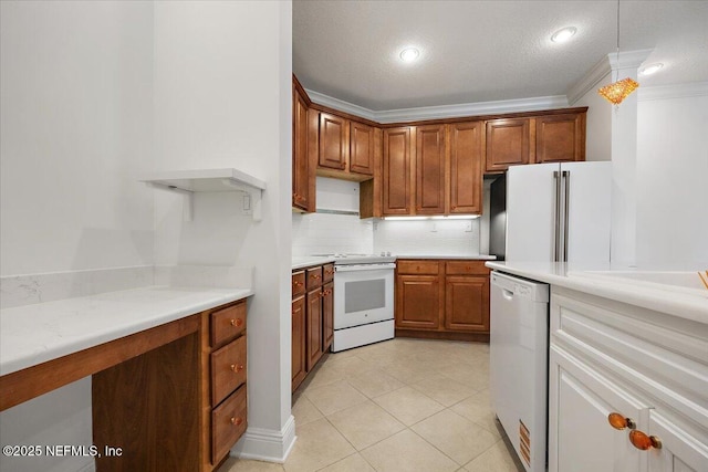4300 S Beach Pkwy Unit 1206, Jacksonville Beach, FL 32250 - kitchen with white appliances, backsplash, light countertops, light tile patterned floors, and brown cabinets