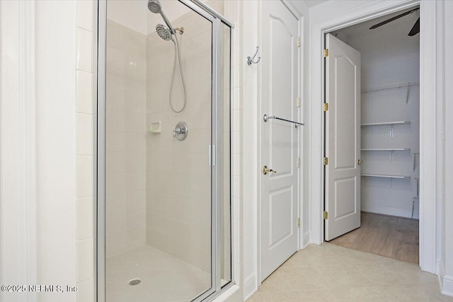 4300 S Beach Pkwy Unit 1206, Jacksonville Beach, FL 32250 - full bath with a stall shower, tile patterned flooring, and a walk in closet
