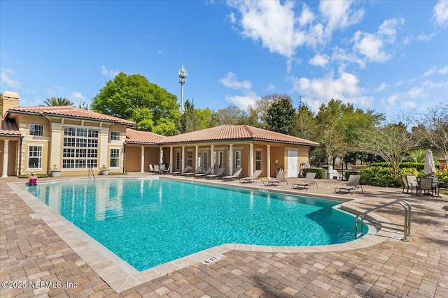 4300 S Beach Pkwy Unit 1206, Jacksonville Beach, FL 32250 - community pool with a patio area