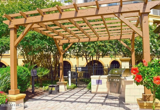 4300 S Beach Pkwy Unit 1206, Jacksonville Beach, FL 32250 - view of patio / terrace featuring an outdoor kitchen and a pergola