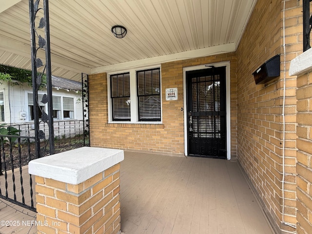 4518 Astral St, Jacksonville, FL 32205 - view of exterior entry with a porch and brick siding