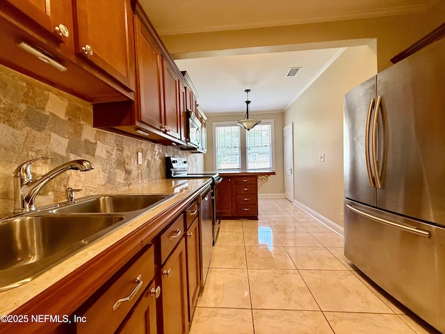 4518 Astral St, Jacksonville, FL 32205 - kitchen featuring appliances with stainless steel finishes, crown molding, tasteful backsplash, pendant lighting, and brown cabinetry