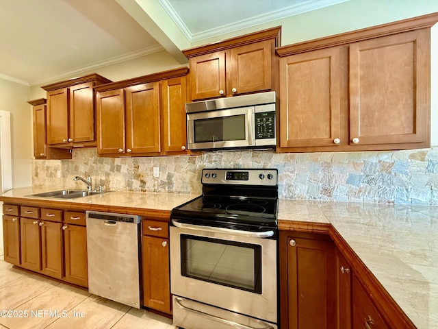 4518 Astral St, Jacksonville, FL 32205 - kitchen with appliances with stainless steel finishes, ornamental molding, light countertops, brown cabinets, and backsplash