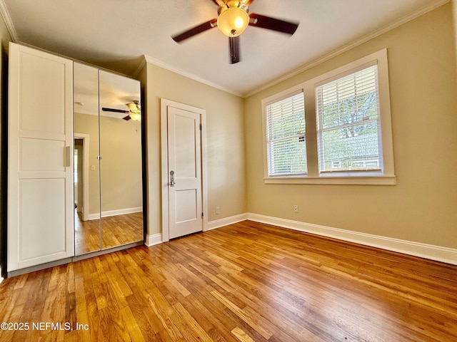 4518 Astral St, Jacksonville, FL 32205 - unfurnished bedroom featuring light wood-style flooring, ornamental molding, a closet, and a ceiling fan