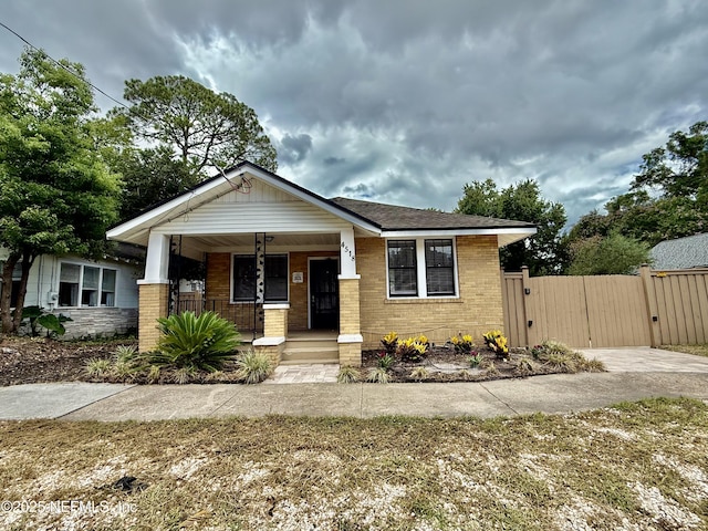 4518 Astral St, Jacksonville, FL 32205 - view of front of property featuring a gate, a porch, and brick siding