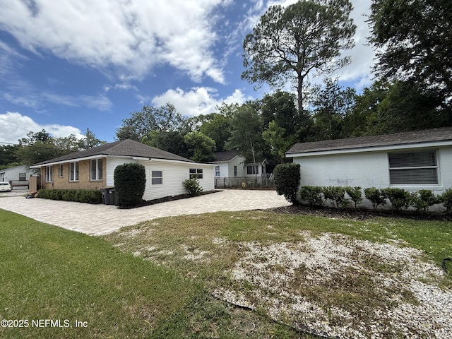 4518 Astral St, Jacksonville, FL 32205 - view of side of home with a patio
