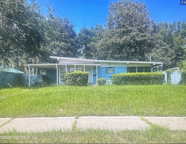 6227 Sprinkle Dr N, Jacksonville, FL 32211 - view of front facade featuring an attached carport