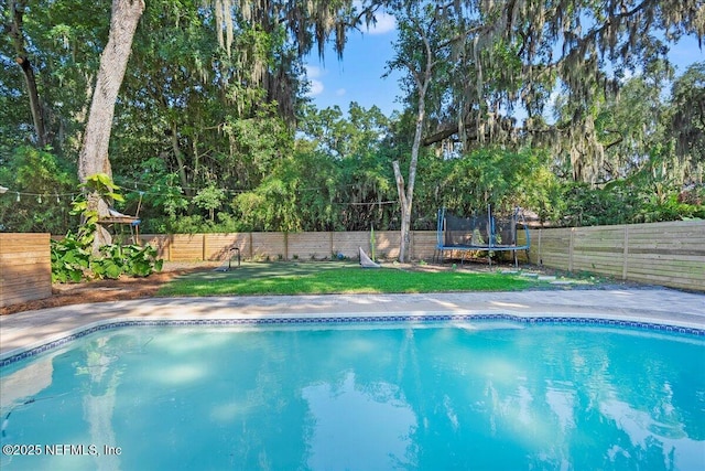 2748 Scott Mill Ter, Jacksonville, FL 32257 - view of swimming pool with a trampoline and a fenced backyard