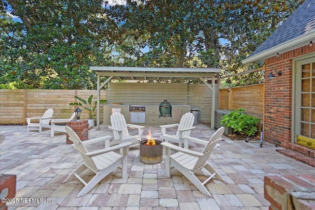 2748 Scott Mill Ter, Jacksonville, FL 32257 - fenced backyard with a fire pit and a patio