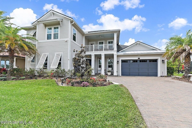 195 Glenneyre Cir, Saint Augustine, FL 32092 - view of front of property with a balcony, decorative driveway, a front yard, and a garage