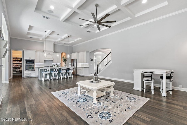 195 Glenneyre Cir, Saint Augustine, FL 32092 - living room featuring arched walkways, ceiling fan, coffered ceiling, a towering ceiling, and beamed ceiling
