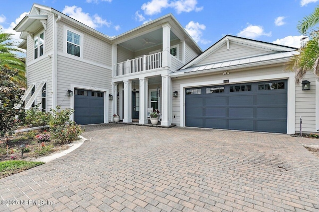 195 Glenneyre Cir, Saint Augustine, FL 32092 - view of front facade featuring a balcony, decorative driveway, and a garage