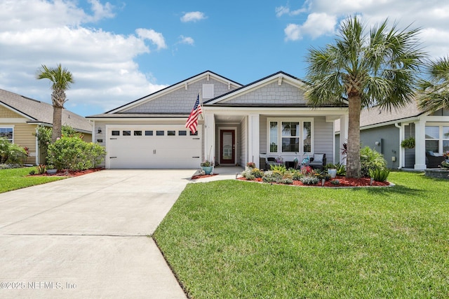 44 Spotted Owl Ln, Saint Augustine, FL 32095 - view of front of home with a garage, driveway, a front yard, and covered porch