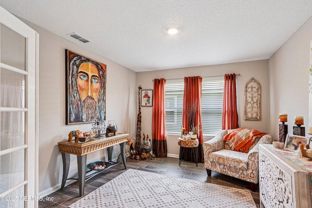 44 Spotted Owl Ln, Saint Augustine, FL 32095 - sitting room with a textured ceiling and baseboards